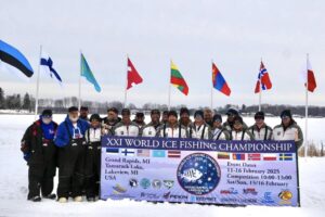 US Ice Fishing Team at the flags in Lakeview Michigan - Discover Montcalm Podcast Lakeview National Ice Fishing Championship US Ice Fishing Team